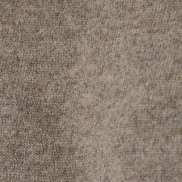 Close-up of a textured beige fabric surface