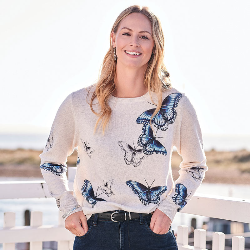 women wearing and butterfly printed cashmere sweater 