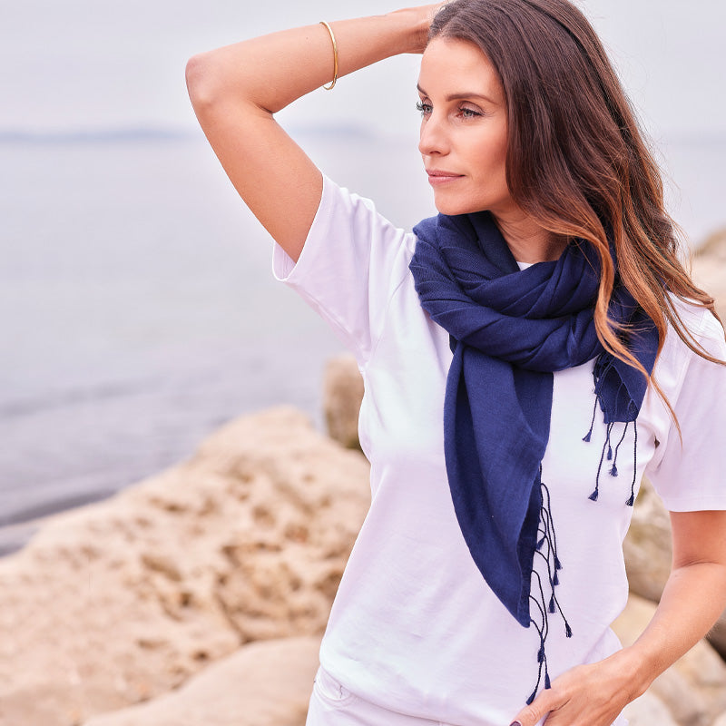 Woman wearing a navy wrap on a beach